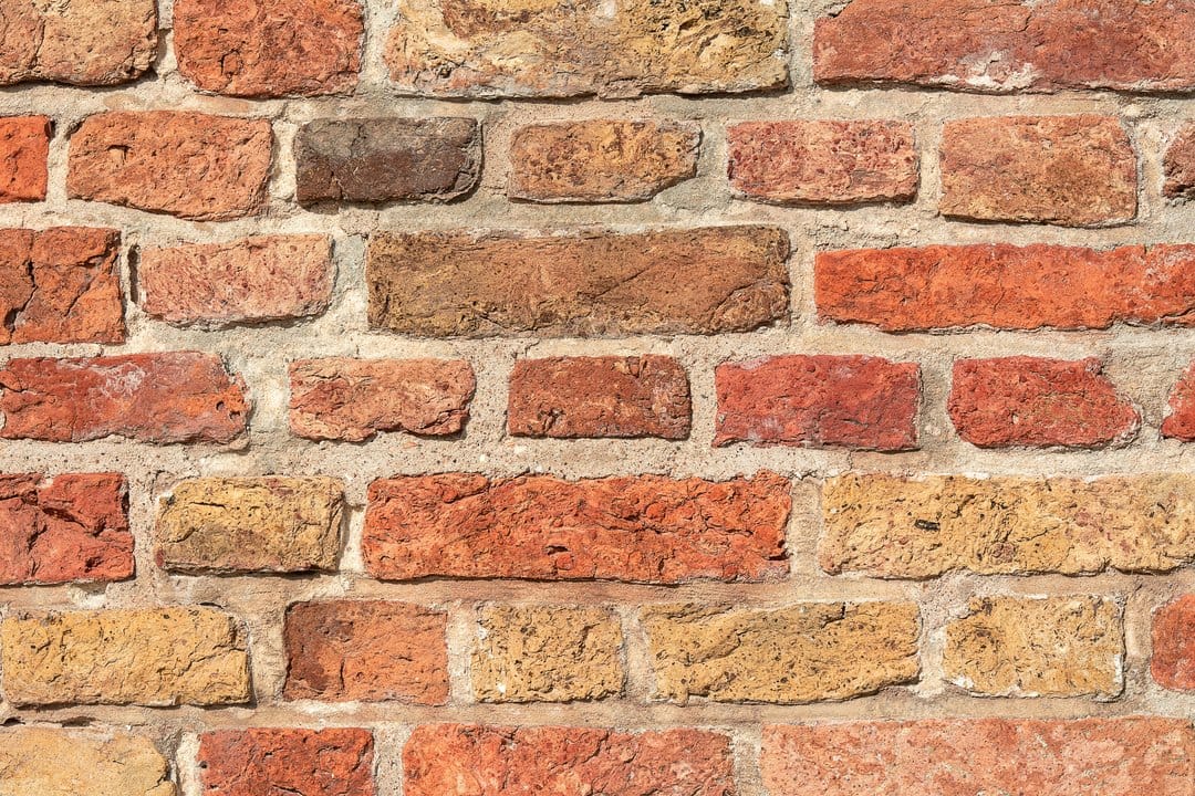Repointing brickwork in summer 2026: the lime-versus-cement decision that quietly wrecks older UK walls