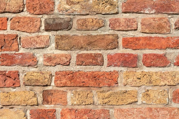 Repointing brickwork in summer 2026: the lime-versus-cement decision that quietly wrecks older UK walls
